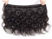 I capelli lunghi ondulati brasiliani vergini di 100% impacchettano tre parti 4 x chiusura 4